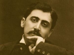 Historisches Porträt von Marcel Proust mit der Hand am Kinn